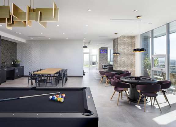 Community lounge with billiards and dining area at LUX by Garden* Apartments, San Diego, 92122