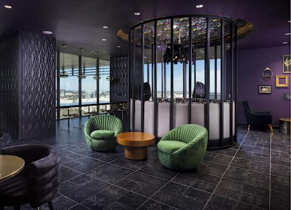 Luxury lounge with circular glass meeting space at LUX by Garden* Apartments, San Diego, 92122