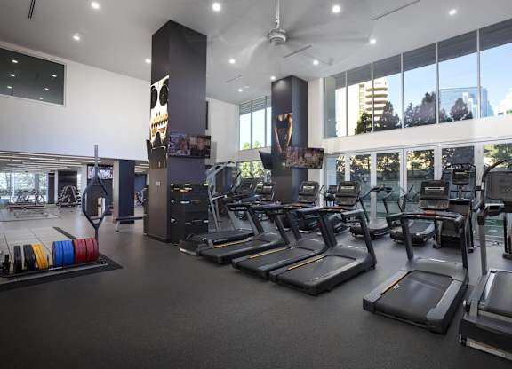 Fitness center with treadmills and cardio equipment at LUX by Garden* Apartments, San Diego, California