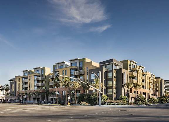 Modern multi story apartment complex with street view at Metropolis Apartments, California