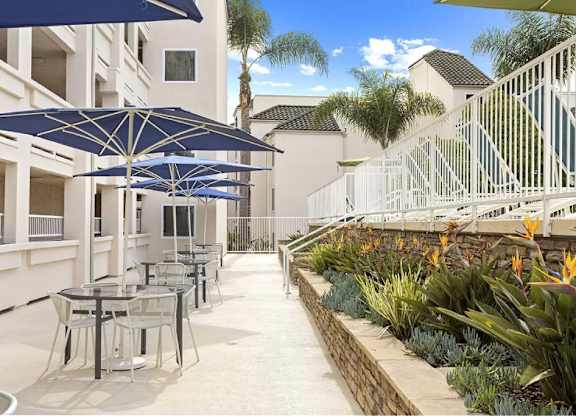 Courtyard Shaded Dining Tables at La Regencia Apartments, San Diego, California