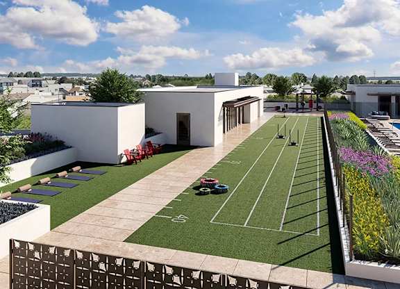 Rooftop fitness track with artificial turf and marked lanes at Garden at 3Roots Apartments, San Diego, CA 92126