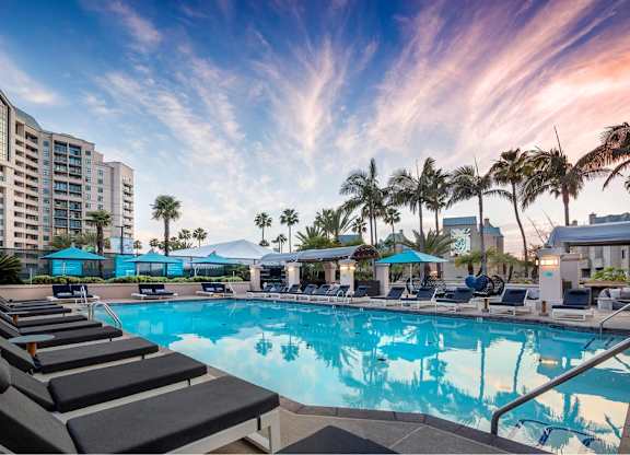 Pool With Relaxing Chairs at Towers at Costa Verde Apartments, San Diego, California
