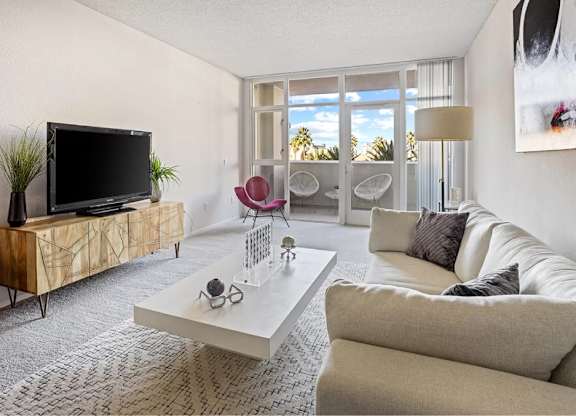 Living Room With TV at Towers at Costa Verde Apartments, San Diego, 92122