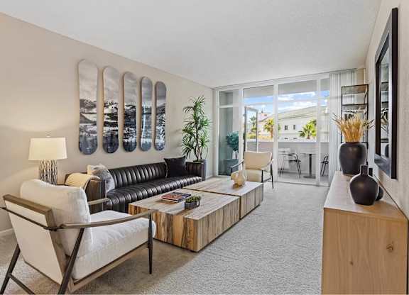 Living Room With Balcony at Towers at Costa Verde Apartments, San Diego, CA, 92122