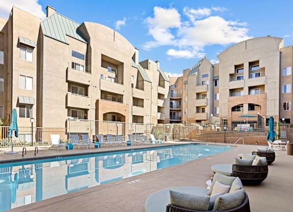 Outdoor pool area with lounge furniture at Costa Verde Village Apartments, San Diego, CA 92122