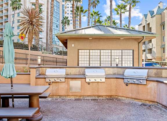 Outdoor bbq grills with covered pavilion and seating at Costa Verde Village Apartments, San Diego