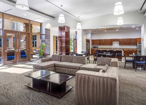 Community lounge with seating and full kitchen at Costa Verde Village Apartments, California, 92122