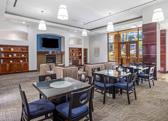 Clubhouse dining and lounge area with fireplace at Costa Verde Village Apartments, San Diego, CA 92122
