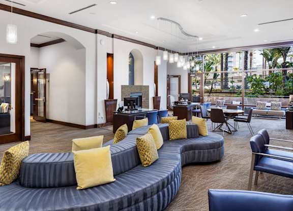 Community lounge with modern seating and fireplace at Costa Verde Village Apartments, San Diego, California