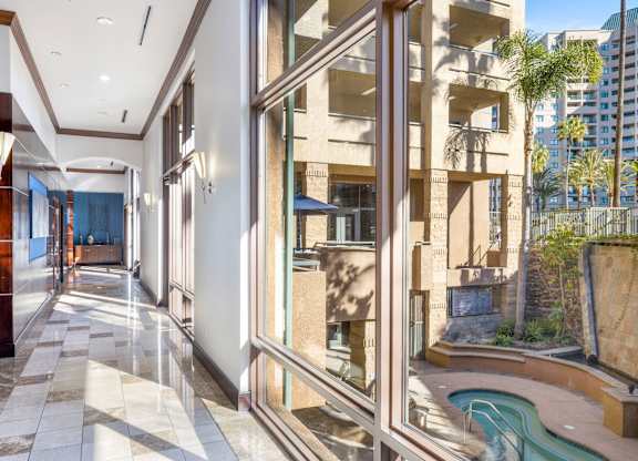 Interior hallway with courtyard views and spa area at Costa Verde Village Apartments, California, 92122