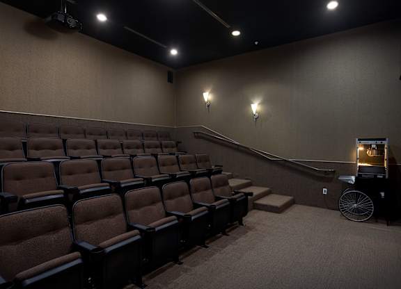 Private screening room with tiered stadium seating at Costa Verde Village Apartments, San Diego, CA 92122