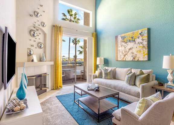 Living room with high ceilings and patio doors at Costa Verde Village Apartments, San Diego, California