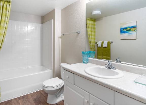 Bathroom with white vanity and tub shower combo at Costa Verde Village Apartments, San Diego, California