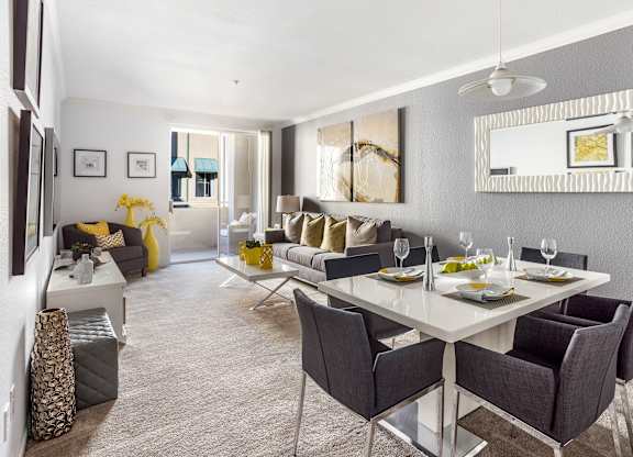 Open living and dining room with gray decor at Costa Verde Village Apartments, San Diego, CA 92122