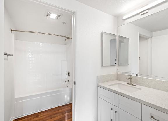 Bathroom with white subway tile shower surround at Costa Verde Village Apartments, San Diego, 92122