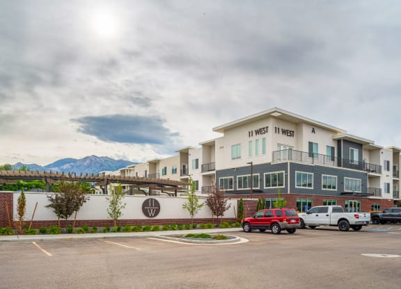 a large building with a parking lot in front of it