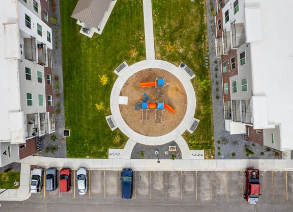 a birdseye view of a park with a circular seating area
