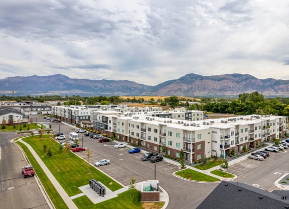 an aerial view of an apartment complex with a mountain range in the background