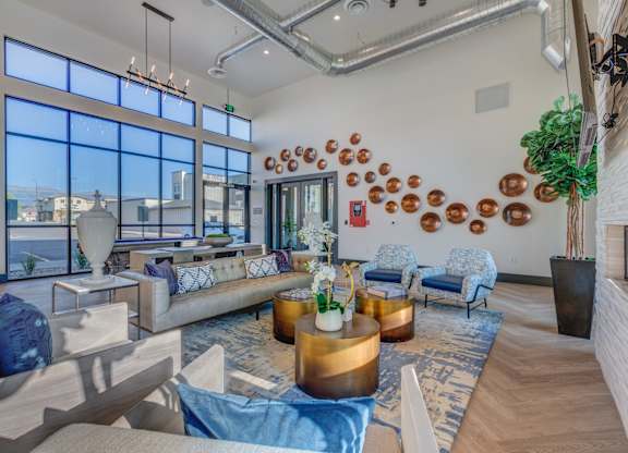 A modern living room with a large window and a view of the city.