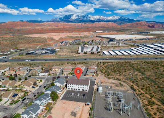 an aerial view of a building with a location icon on top of it