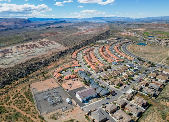 an aerial view of a community with houses and a road