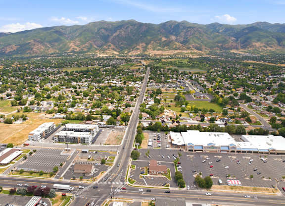A view of a town with a mountain in the background.