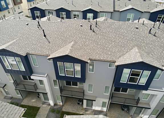 A view of a residential area with houses and apartment buildings.