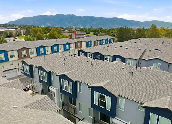 Apartment complex with a mountain in the background.