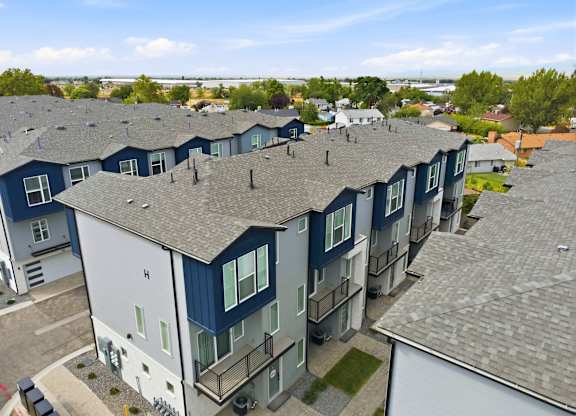 A row of houses with blue and white exteriors.