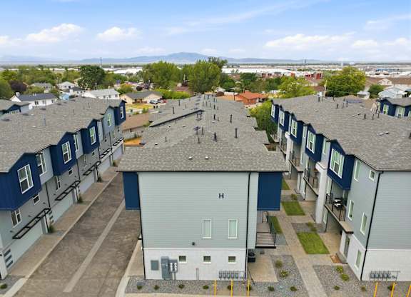 A view of a residential area with houses and apartment buildings.