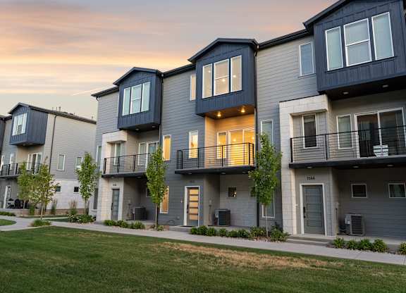 Apartment complex with multiple buildings and balconies.