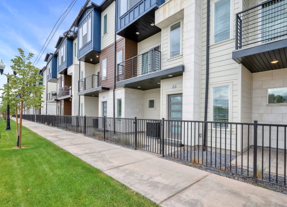 the preserve at cardinal heights apartments exterior view with sidewalk and grass