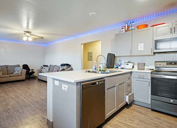 A kitchen with a washer and dryer built in.