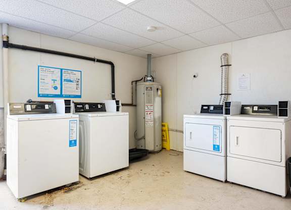 A room with white appliances and a white ceiling.