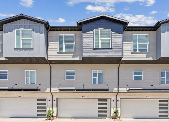 A row of modern houses with garages.