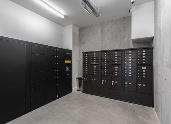 a bunch of black lockers in a room