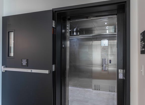 the door to the elevator in the lobby of a building