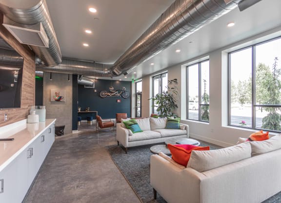 a large living room with couches and a table