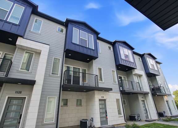Apartment building with balconies and doors numbered 134 and 135.