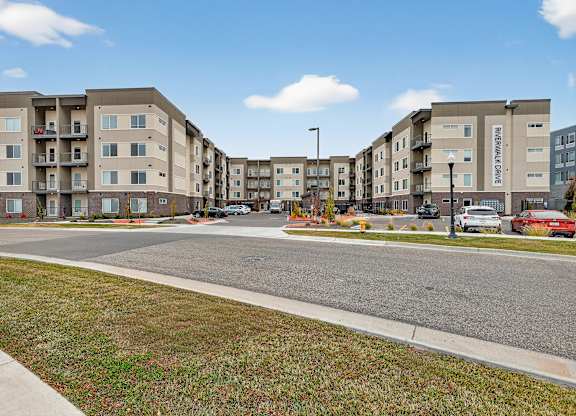 Apartment complex with a street in front.