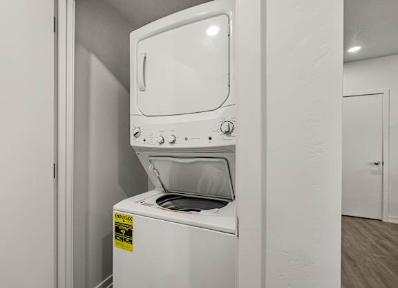 A white oven with a sticker on it.