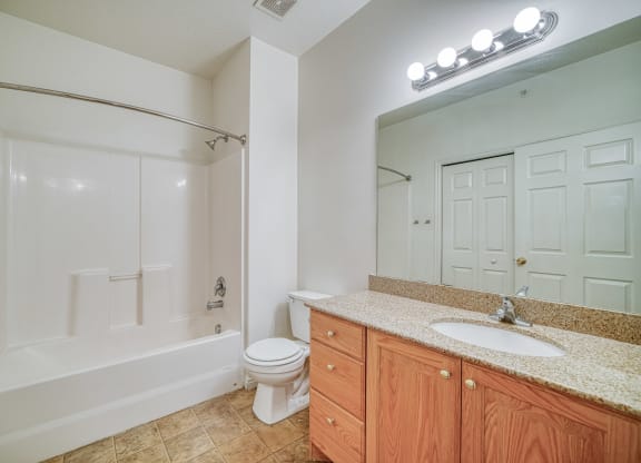 a bathroom with a toilet sink and bathtub