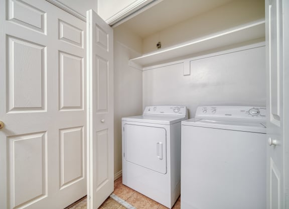 a laundry room with a washer and dryer