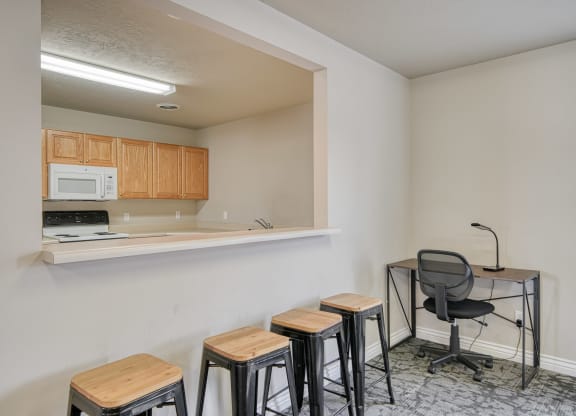 a room with a small table and four stools