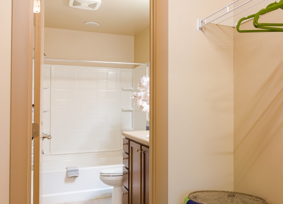 a bathroom with a shower and a toilet and a sink at Sugar House Apartments By Urbana, Salt Lake City, UT, 84105