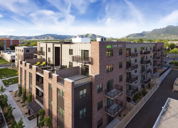 a rendering of a building with a blue sky in the background at Sugar House Apartments By Urbana, Salt Lake City, UT, 84105