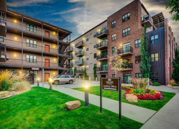 an apartment building with a car parked in front of it at Sugar House Apartments By Urbana, Salt Lake City, UT, 84105