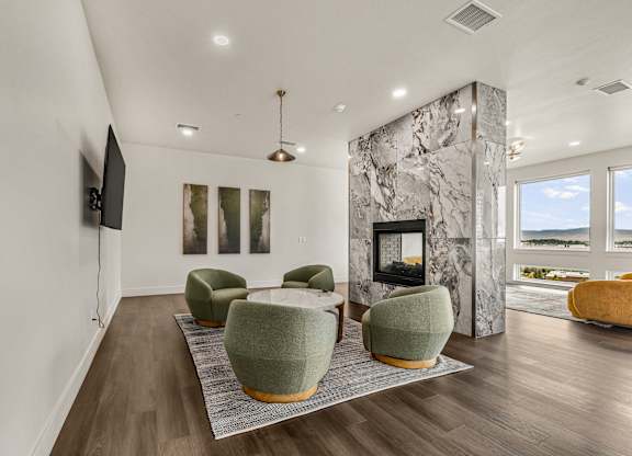 A living room with a fireplace and a television.
