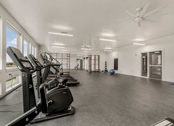 A spacious gym with treadmills and exercise equipment.